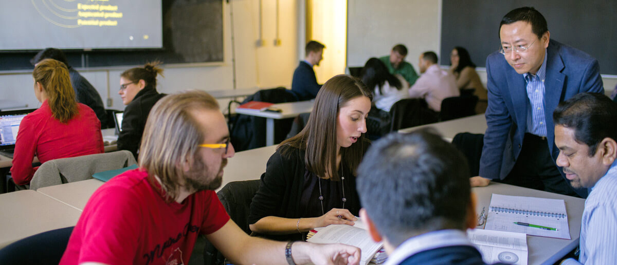 Graduate students in classroom. 