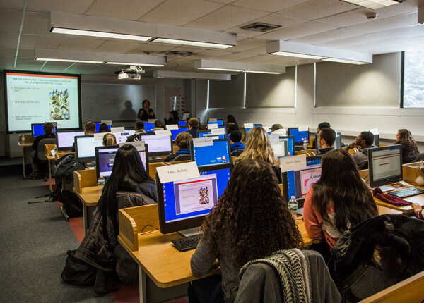 Barney finance students listen to a lecture in class