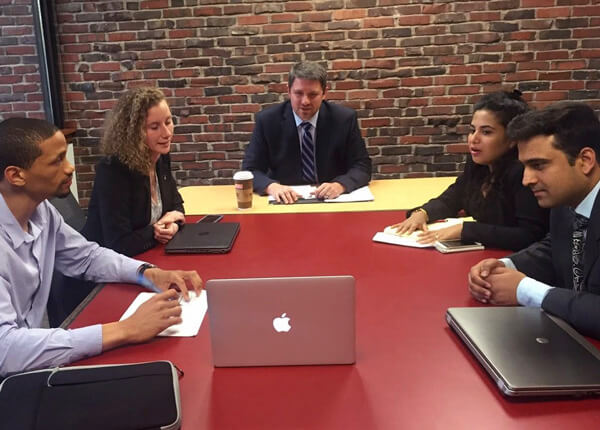 Barney Consulting Services members at desk