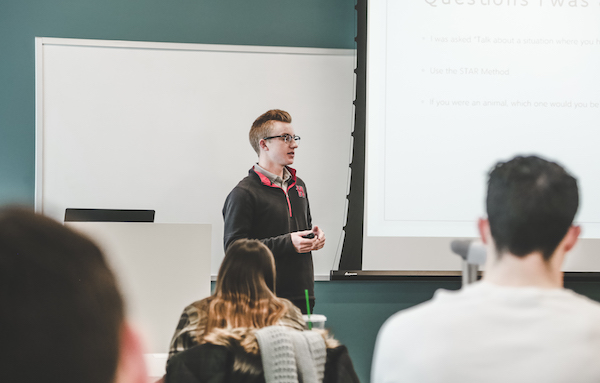 Student is talking in the trading lab