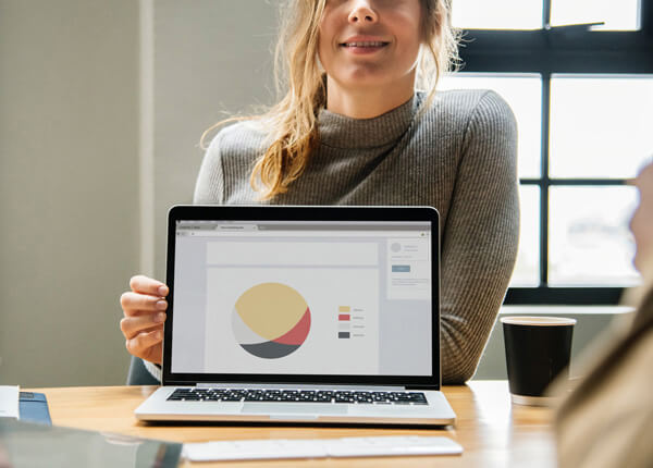 Student showing a presentation on her computer