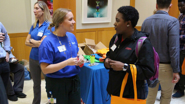 Students network at a marketing event