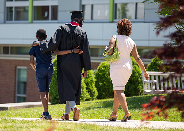 UHart graduate with family