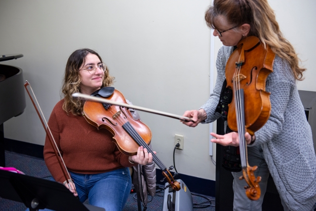 Melinda Daetsch happily became "bilingual" with violin and viola at the age of 12.
