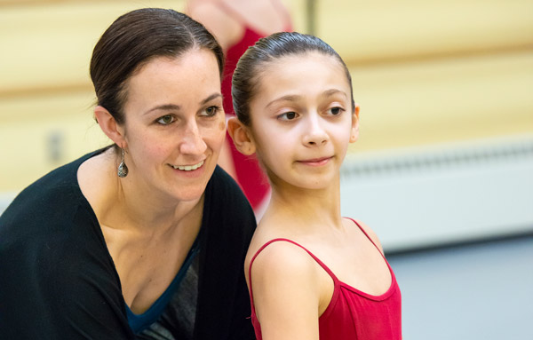 Dance Department Administrative Director Jillian Cote working with a student.