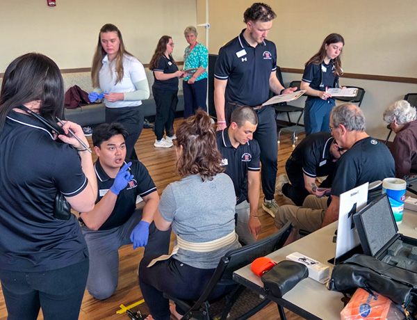 DPT students working with community members