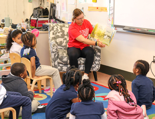 student reading book in classroom