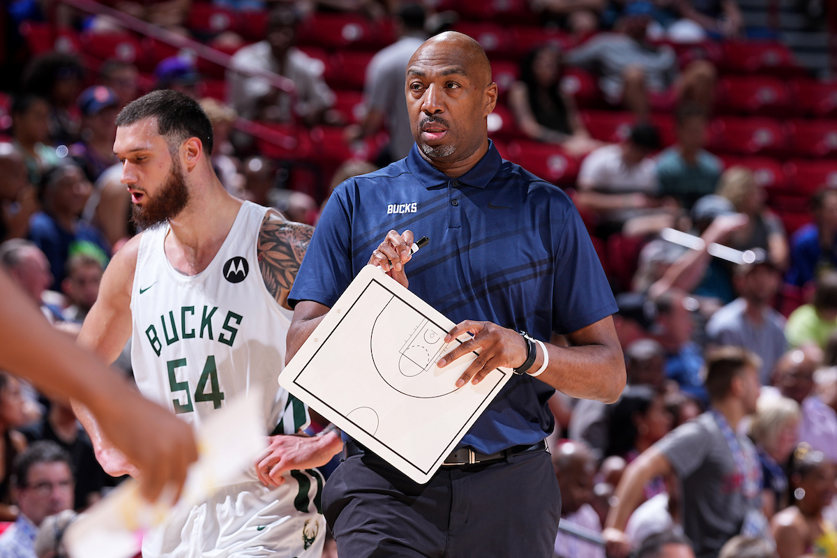 Vin Baker on court coaching Bucks game