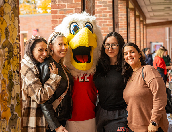 Hawktober alumni with Howie the Hawk