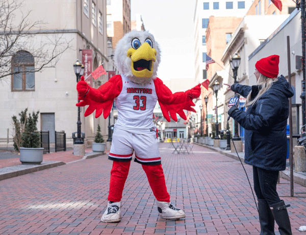 Howie and a fox 61 reporter dancing.