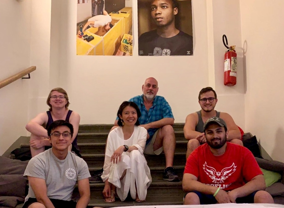Ceta graduate students and professor abroad on steps