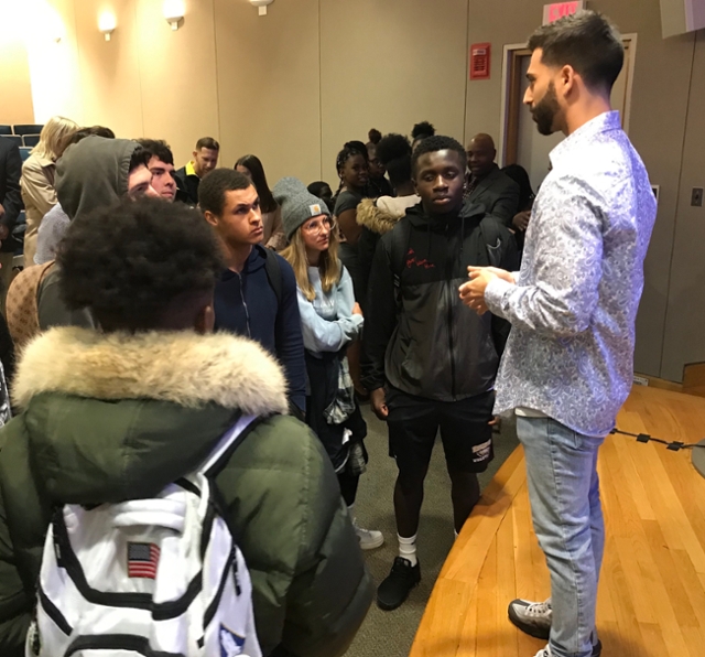 Brandon Korn speaks with students after award ceremony.