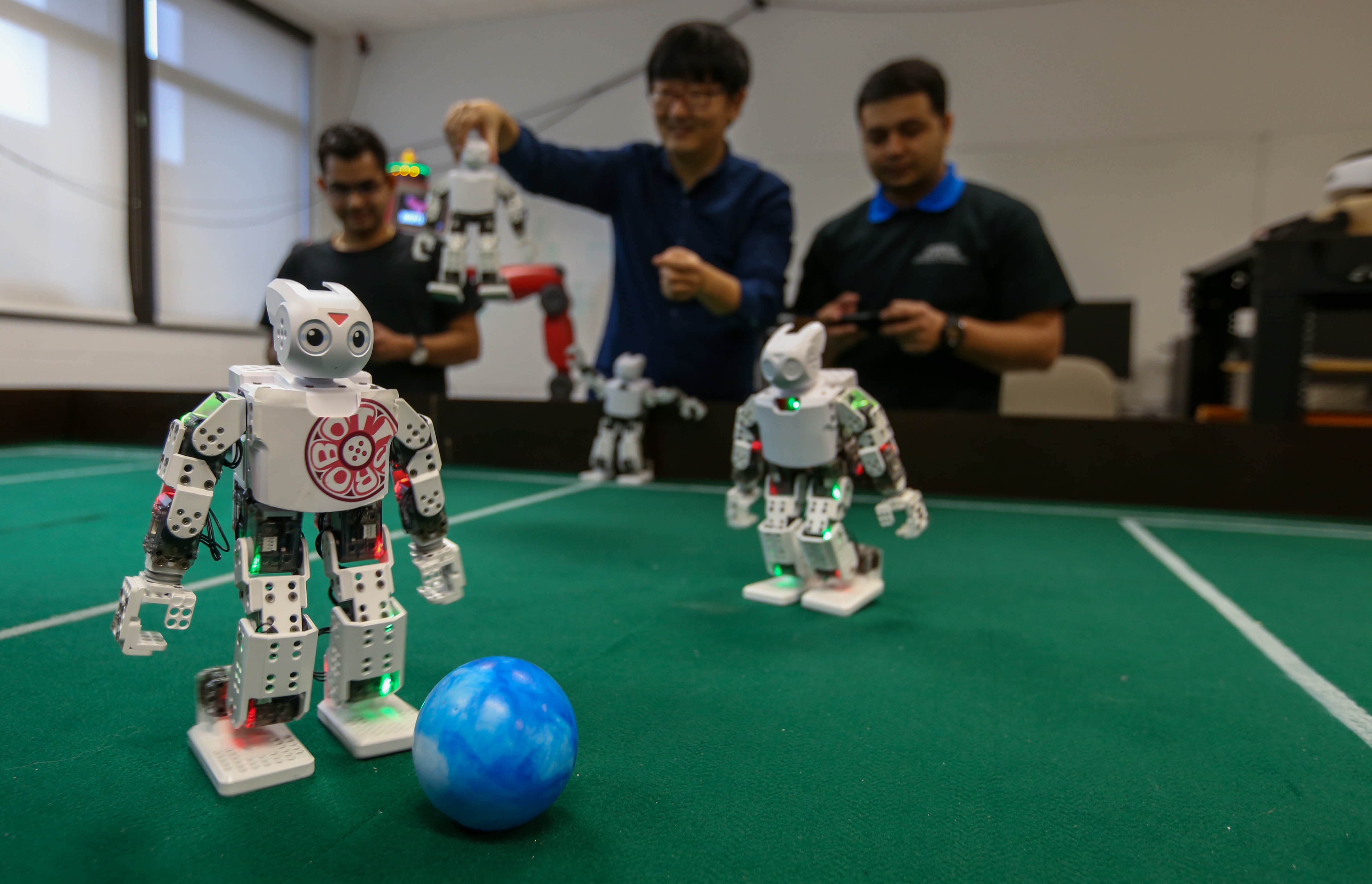 Students with robots in a lab