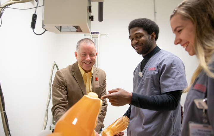 Dan DeMaio in lab with students