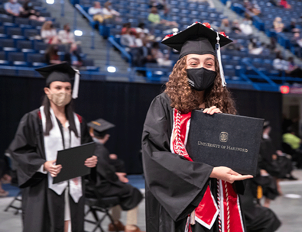photo of a graduate showing diploma