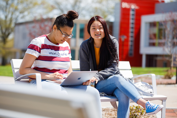 Two students working on campus