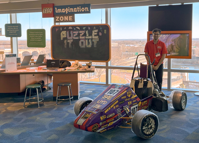 UHart student with a formula 1 car