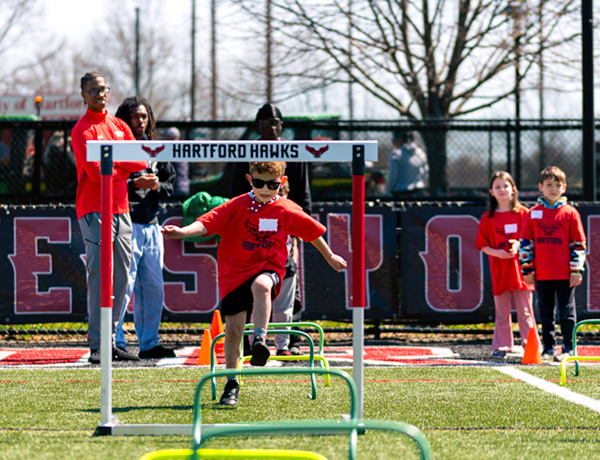 child running an obstacle course