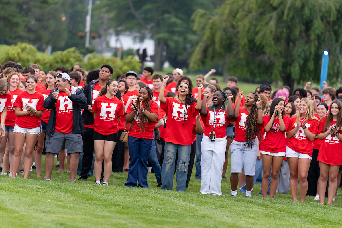 Class of 2030 form a human H on the quad.
