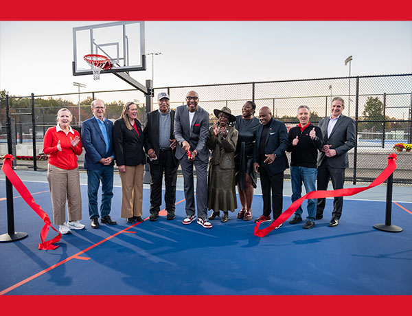 line of people at a ribbon cutting