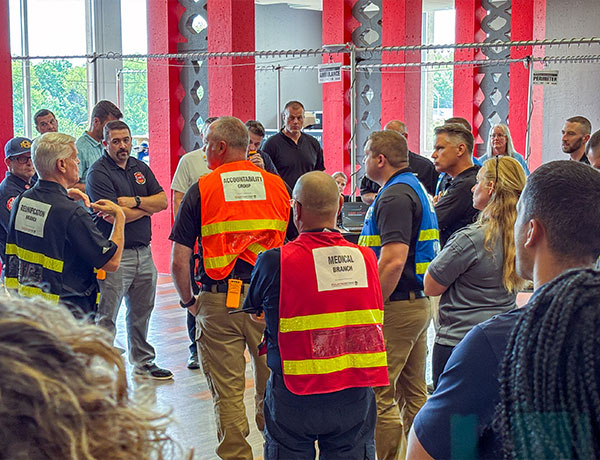 people gathering at a safety meeting