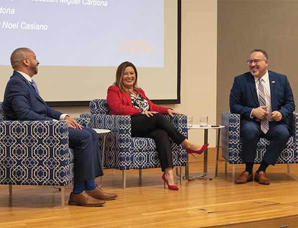 U.S. Secretary of Education Miguel Cardona (far right) with his wife, Marissa Perez Cardona, in a discussion on campus moderated by Hillyer College Associate Professor Noel Casiano.