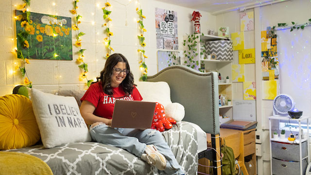 student in dorm room