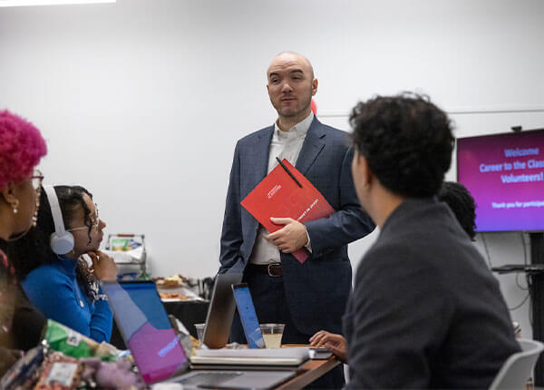 Staff speaking with students in the Career Studio