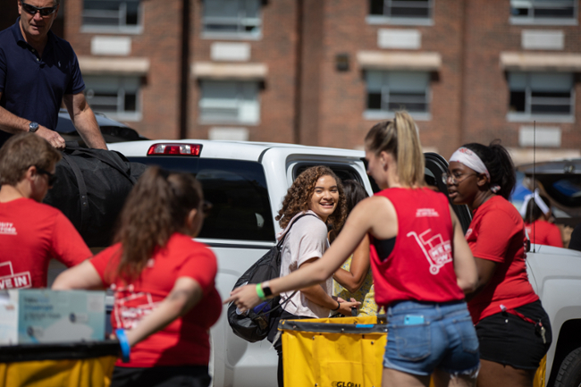 Students unpacking car during move-in weekend