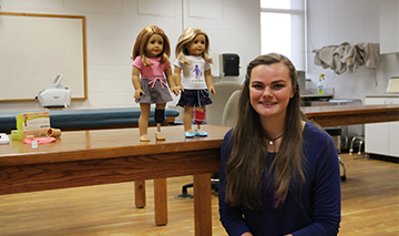 Mikaela Nelson with dolls