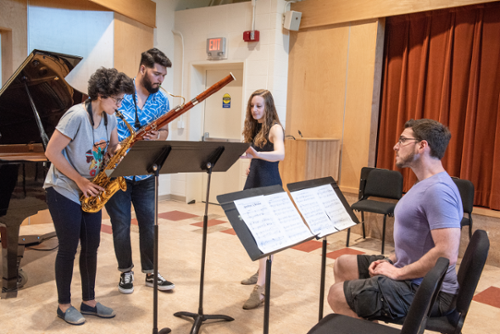 Gala Flagello and Aaron Price, are, respectively, Festival Director and Artistic Director of Summerfest. Here they are working with musicians Alexander Davis (bassoonist) and Ana Garcia Caraballos, (saxaphonist) on an original composition by Aaron Price.