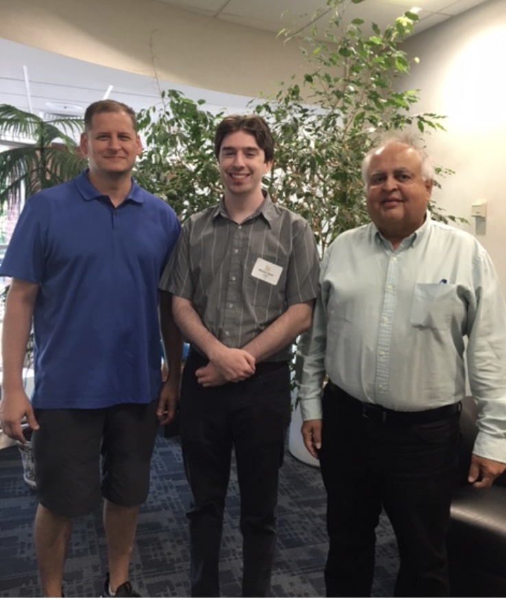 three gentlemen standing together