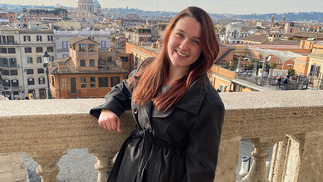 female in front of sky line