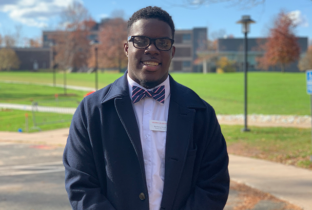 young man headshot on college campus