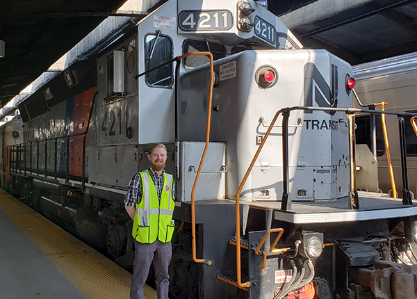 man in front of train