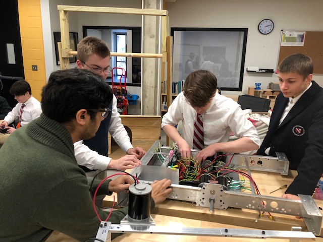 students working on robot