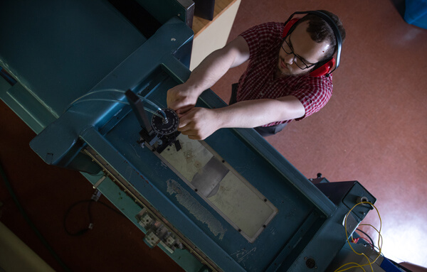 student working on machine