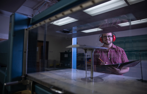 student working on machine