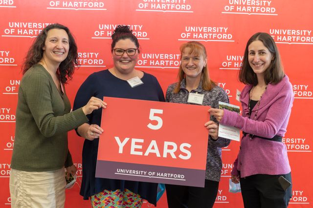 photo of employees who started on same day five years ago