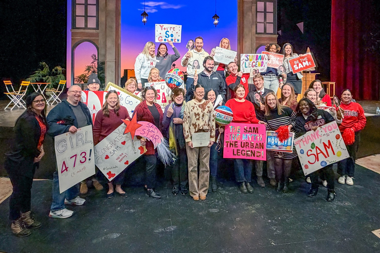 photo of staff celebrating with award winners at Feb. 4 kickoff.