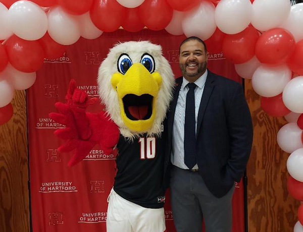 Aaron Isaacs with Howie the Hawk