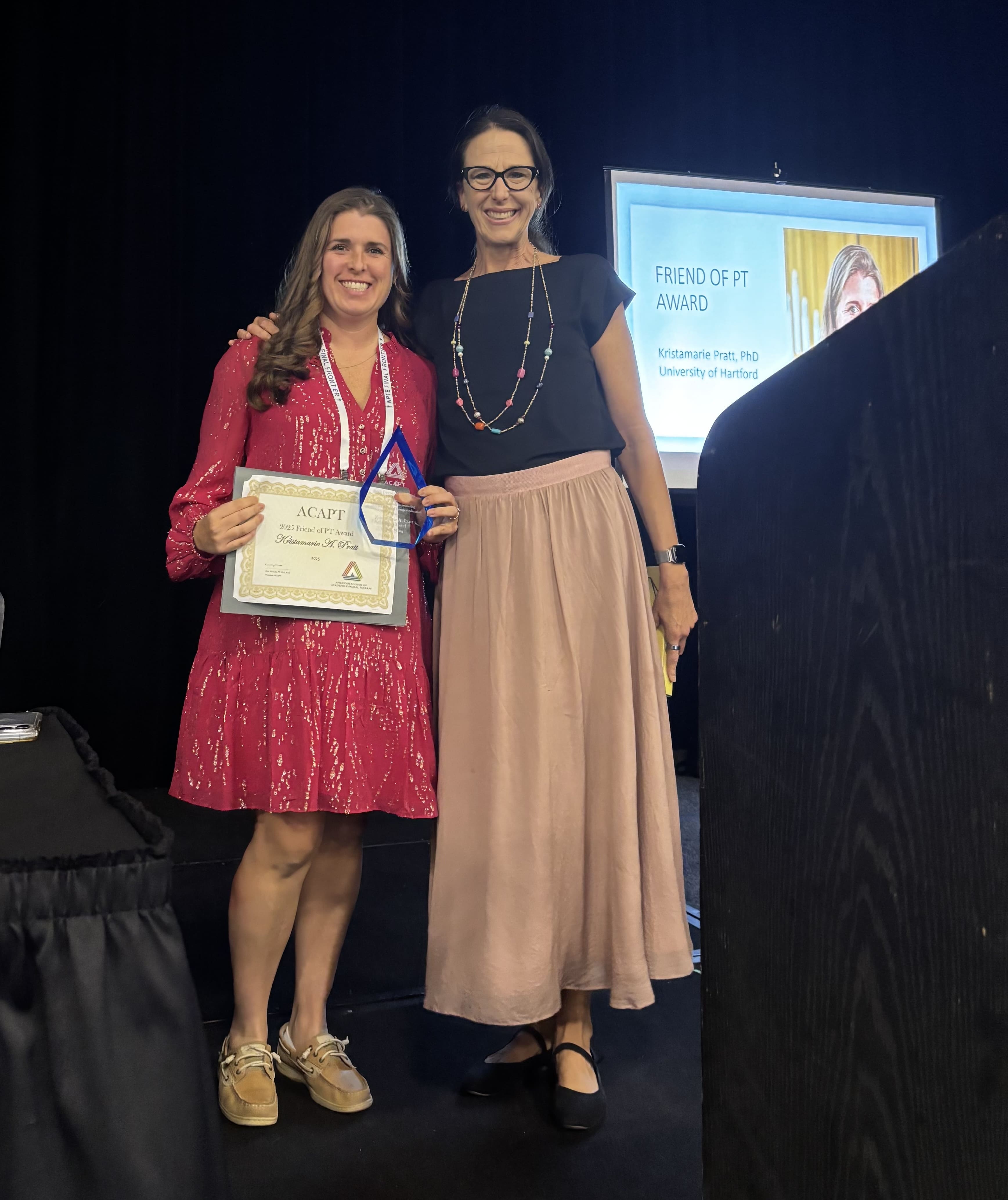 photo of Kristamarie Pratt receiving her award.