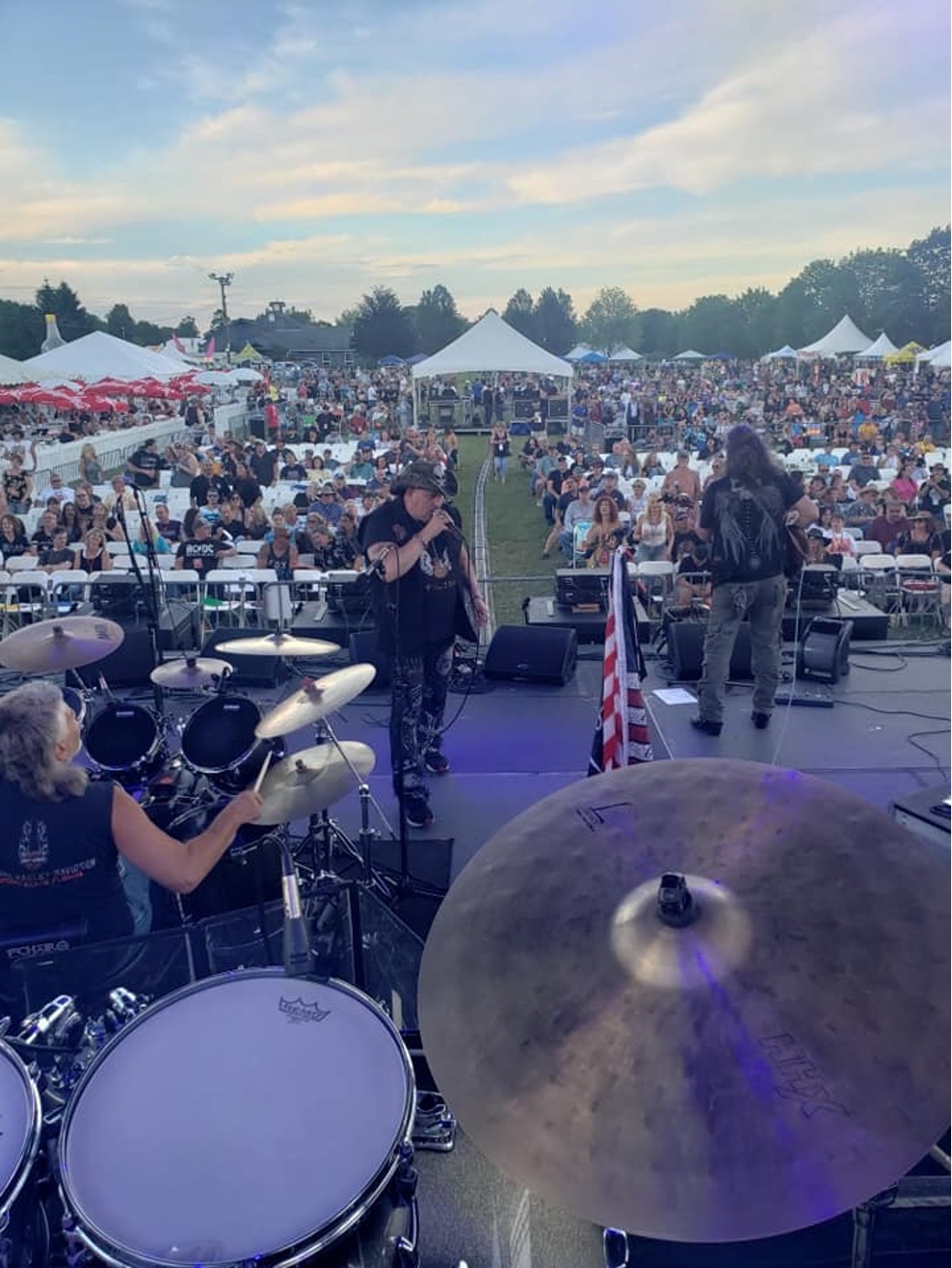 Britt (right) facing the crowd during his band's performance.